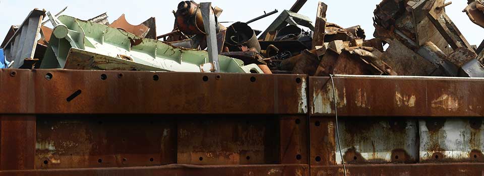 Tractor Trailer at scrap yard with headline: 8,174 jobs in KY paying $447.7 million in wages.